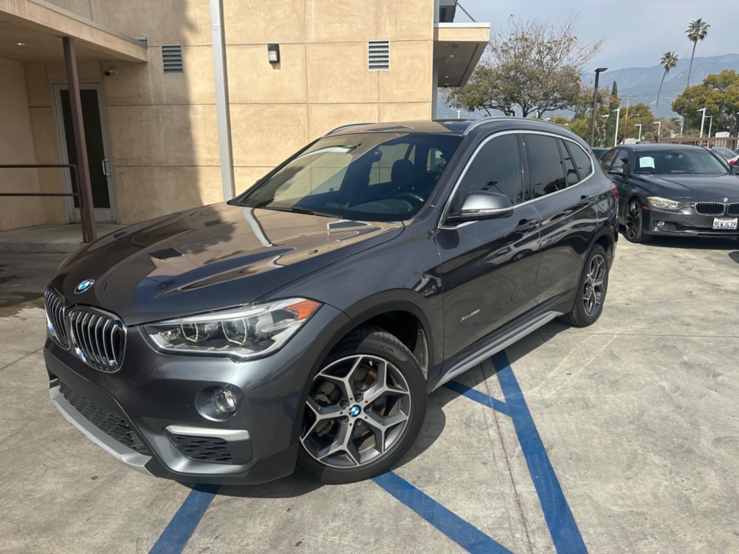 2016 Gray /Black BMW X1 leather (WBXHT3Z34G4) with an 4 CYLINDER engine, Automatic transmission, located at 30 S. Berkeley Avenue, Pasadena, CA, 91107, (626) 248-7567, 34.145447, -118.109398 - Crown City Motors is a used “Buy Here Pay Here” car dealer in Pasadena CA. “Buy Here Pay Here” financing, means that when you purchase your vehicle from our dealership, that you make the payments to the dealership as well. We do not need the banks approval to get you approved for a used auto - Photo#0